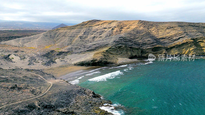 Aerial view of "Pelada" beach at the natural reserve of "Monta?a Pelada" in Tenerife (Canary Islands). Drone shot